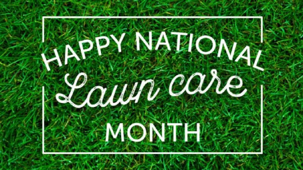 A cheerful sign celebrating National Lawn Care Month placed on a lush green lawn.